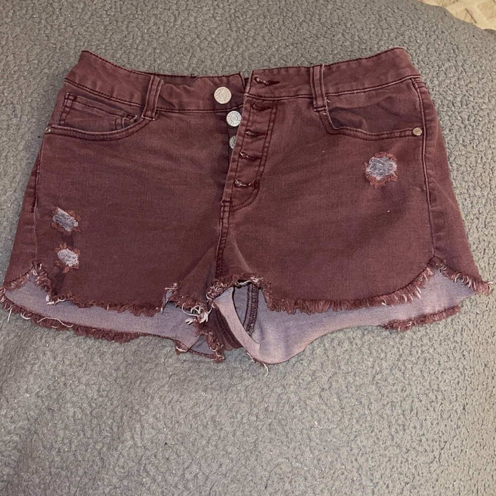 Burgundy jean shorts with holes